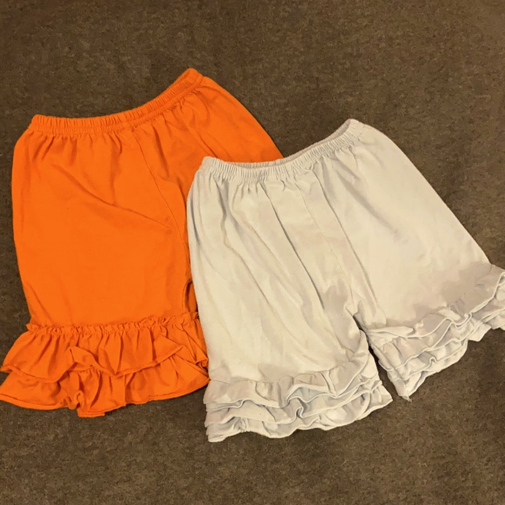 Two pair Size 4 ruffle leg shorts.
